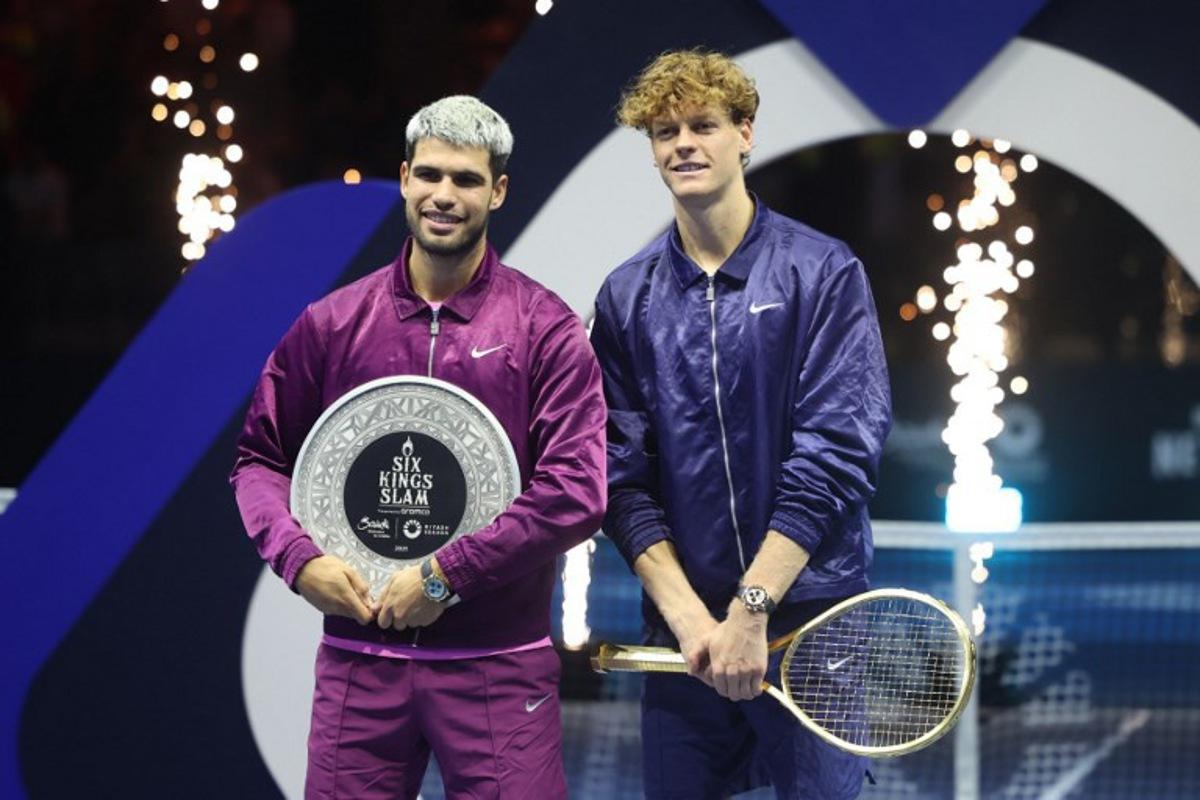 Italy's Jannik Sinner (R) and Spain's Carlos Alcaraz pose for photos at the end of the final of the Six Kings Slam exhibition tennis tournament in Riyadh on October 18, 2025. Fayez NURELDINE / AFP