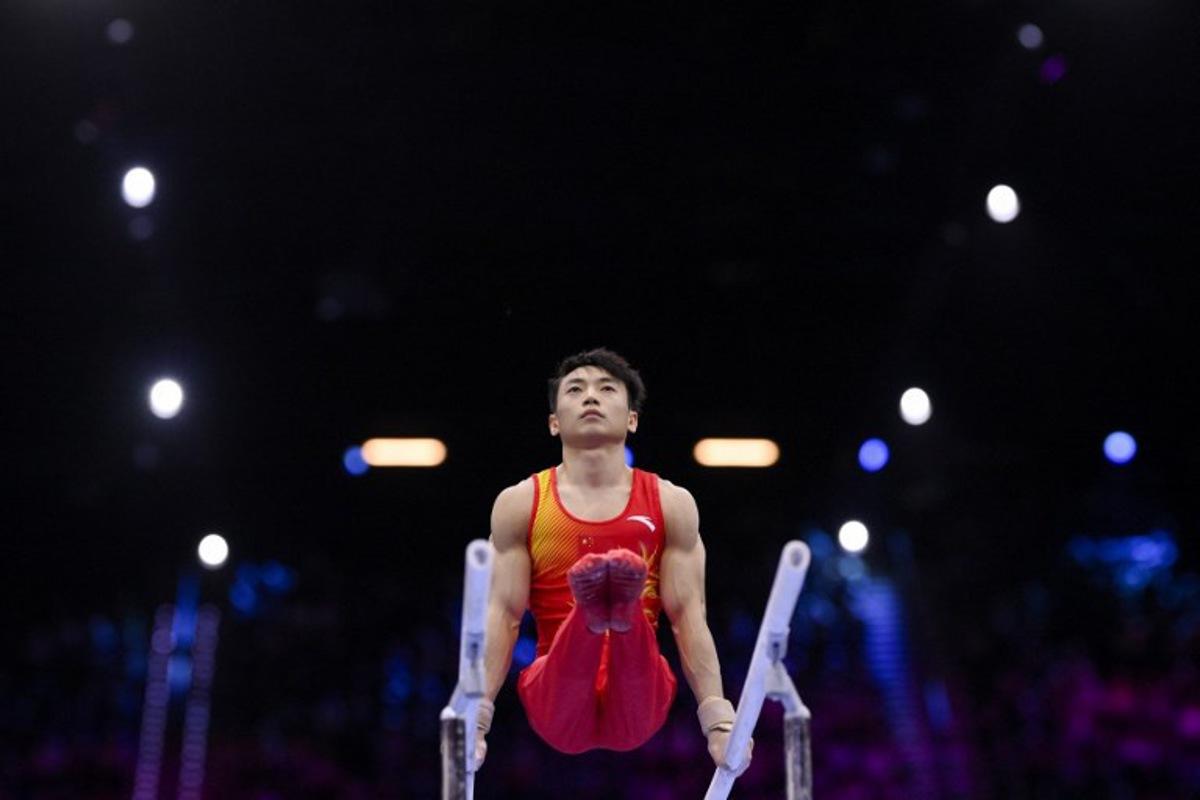China's Jingyuan Zou competes in the Men's Parallel Bars Final during the 54th FIG Artistic Gymnastics World Championships, in Rotterdam, southern Netherlands, on October 25, 2026. JOHN THYS / AFP
