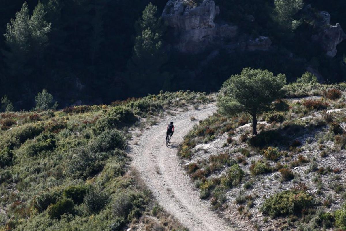 A man rides a bicycle in the hills above Marseille., on January 15, 2026, in Marseille. Thibaud MORITZ / AFP