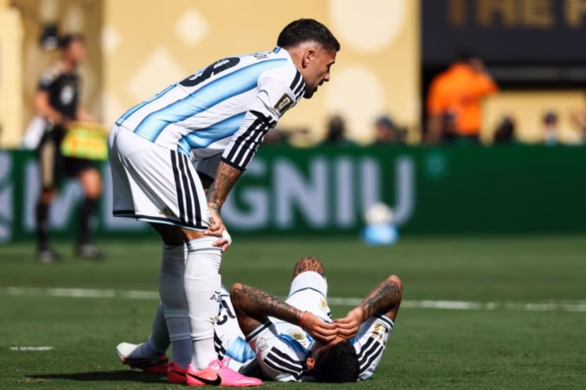 Argentina's defender #13 Cristian Romero (R) lies on the field past defender #19 Nicolas Otamendi during the 2026 World Cup football tournament final match between Spain and Argentina at the New York/New Jersey Stadium in East Rutherford on July 19, 2026. FRANCK FIFE / AFP