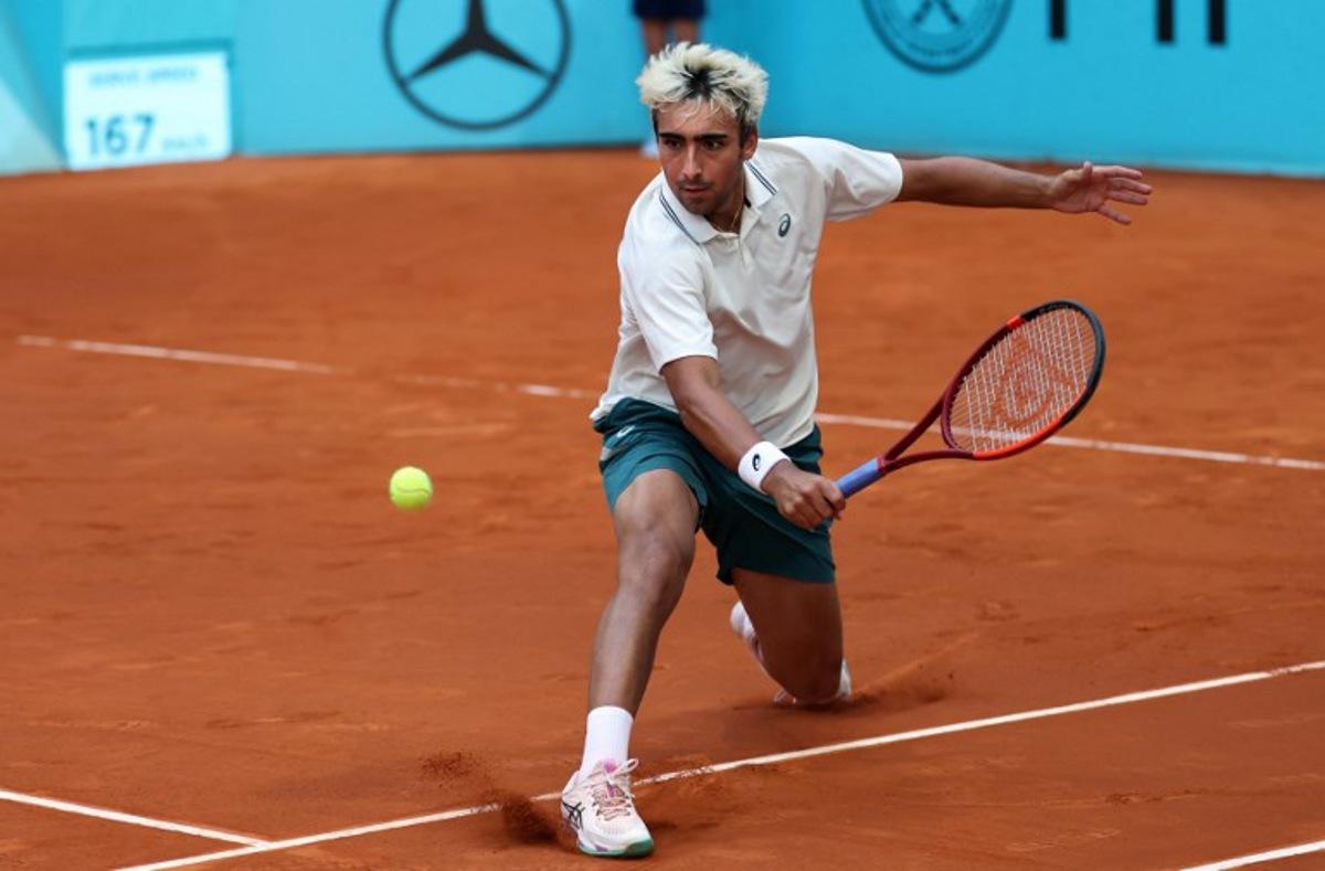 Spain's Daniel Merida returns the ball to France's Corentin Moutet during their 2026 ATP Tour Madrid Open tennis tournament third round singles match at the Caja Magica in Madrid, on April 25, 2026. Thomas COEX / AFP