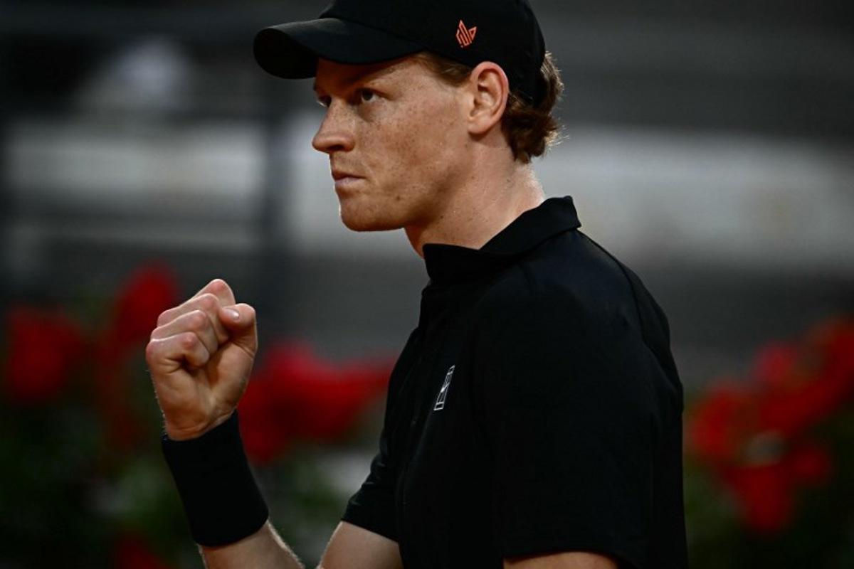 Italy's Jannik Sinner reacts during the men's singles quarter-final match against Norway's Casper Ruud at the ATP Rome Open tennis tournament at Foro Italico in Rome on May 15, 2025. Filippo MONTEFORTE / AFP