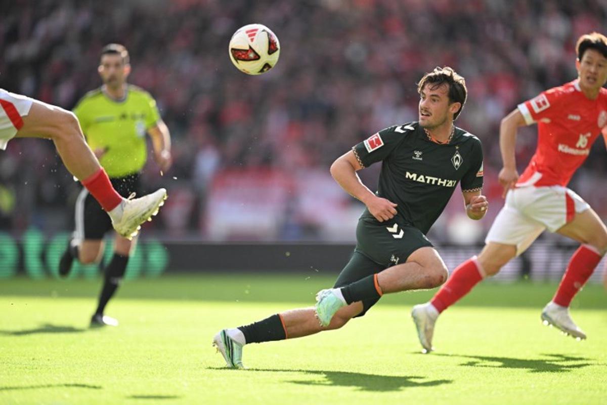 Bremen's Belgian defender #02 Olivier Deman eyes the ball during the German first division Bundesliga football match between Mainz 05 and Werder Bremen in Mainz on October 24, 2026. Kirill KUDRYAVTSEV / AFP