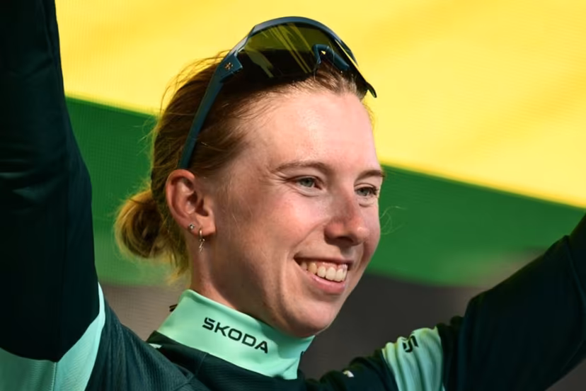Team SD Worx-Protime's Dutch rider Lorena Wiebes celebrates on the podium with the best sprinter's green jersey after the individual time-trial in the 4th (out of 9) stage of the fifth edition of the Women's Tour de France cycling race, 21 km time trial between Gevrey-Chambertin and Dijon, in Dijon, eastern France on August 4, 2026. NICOLAS TUCAT / AFP
