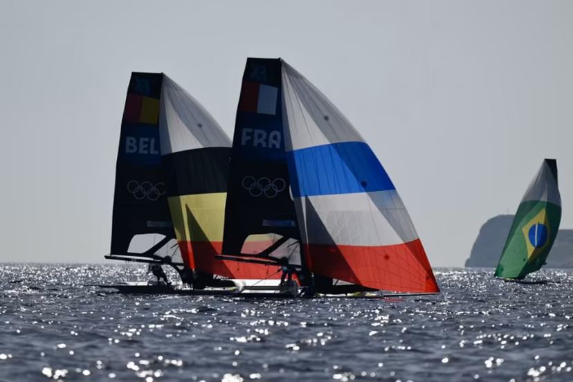 France's duo Sarah Steyaert and Charline Picon and Belgium's duo Isaura Maenhaut and Anouk Geurts compete in Race 6 of the women's 49erFX skiff event during the Paris 2024 Olympic Games sailing competition at Marseille's Marina on July 29, 2024. Christophe SIMON / AFP