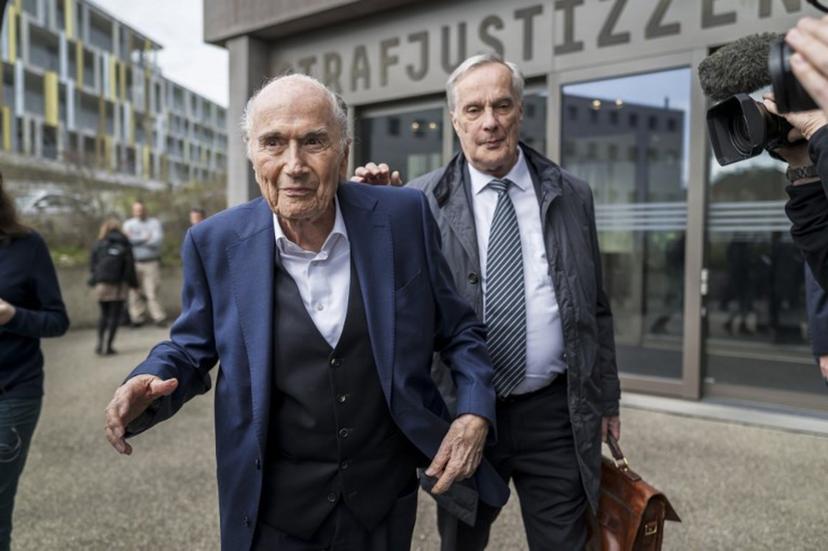 Former FIFA president Sepp Blatter (L) leaves with his lawyer Lorenz Erni (R) the courthouse after the verdict of an appeal by Swiss Attorney General's office against former UEFA and FIFA presidents over a suspected fraudulent payment, in Muttenz near Basel, on March 25, 2025. Former FIFA president Sepp Blatter and ex-UEFA chief Michel Platini were acquitted again on March 25, 2025 on appeal by a Swiss court in a long-running corruption case. Fabrice COFFRINI / AFP
