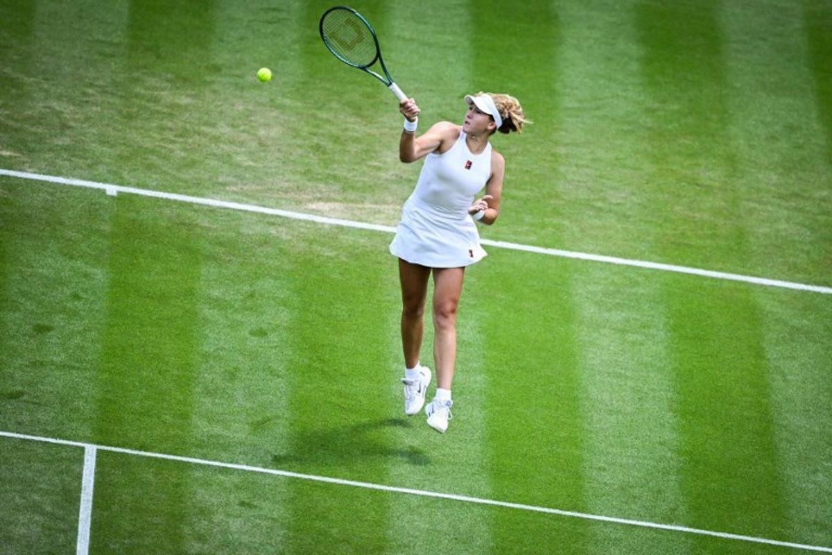 Russia's Mirra Andreeva plays a forehand return to Italy's Lucia Bronzetti during their women's singles second round tennis match on the fourth day of the 2025 Wimbledon Championships at The All England Lawn Tennis and Croquet Club in Wimbledon, southwest London, on July 3, 2025. Kirill KUDRYAVTSEV / AFP