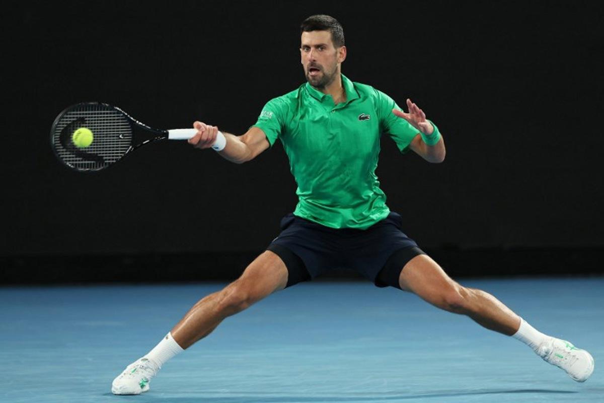 Serbia's Novak Djokovic hits a return to Netherlands' Botic van de Zandschulp during their men's singles match on day seven of the Australian Open tennis tournament in Melbourne on January 24, 2026. Martin KEEP / AFP