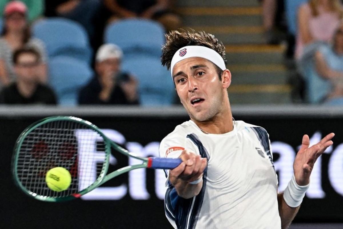 Argentina's Tomas Martin Etcheverry hits a return to Kazakhstan's Alexander Bublik during their men's singles match on day six of the Australian Open tennis tournament in Melbourne on January 23, 2026. Paul Crock / AFP