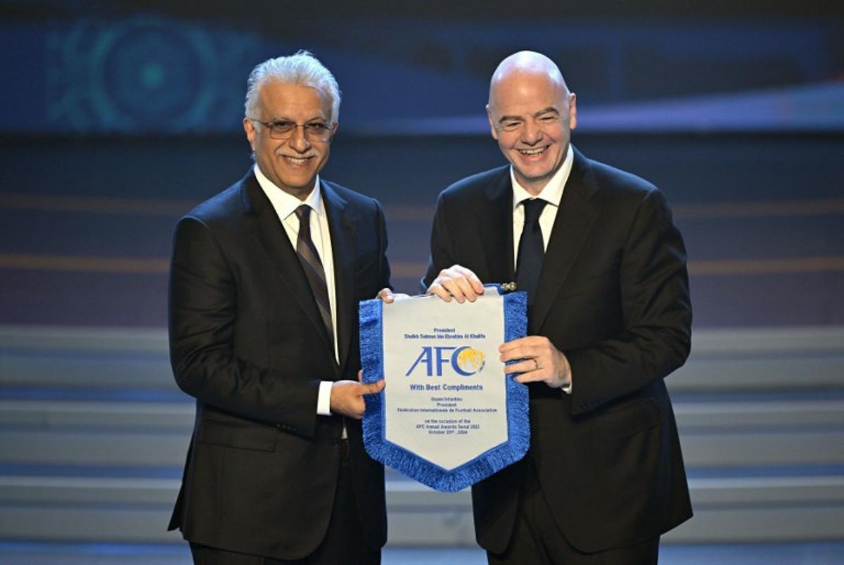 FIFA president Gianni Infantino (R) poses with Sheikh Salman bin Ibrahim al-Khalifa (L), president of the Asian Football Confederation (AFC), during the AFC Annual Awards 2023 ceremony in Seoul on October 29, 2024. JUNG YEON-JE / AFP