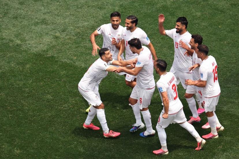 Iran's forward #09 Mehdi Taremi (L) celebrates with teammates a goal which was later disallowed after a VAR review during the 2026 World Cup Group G football match between Belgium and Iran at the Los Angeles Stadium in Inglewood on June 21, 2026. Etienne Laurent / AFP