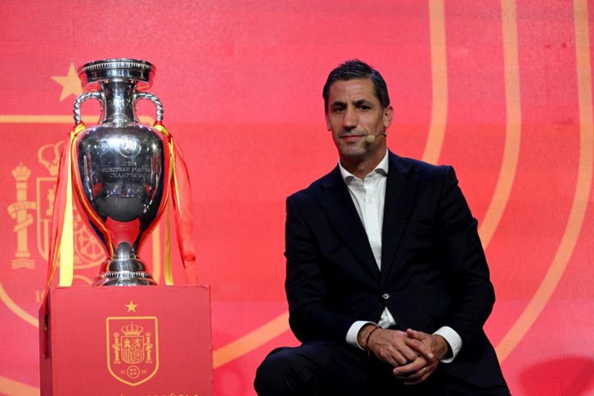 Former Spain's player Joan Capdevila poses next to Henri Delaunay cup, the trophy of the UEFA European Football Championship, during the unveiling of Euro 2024 squad on May 27, 2024 at the Ciudad del Futbol training facilities in Las Rozas de Madrid. JAVIER SORIANO / AFP