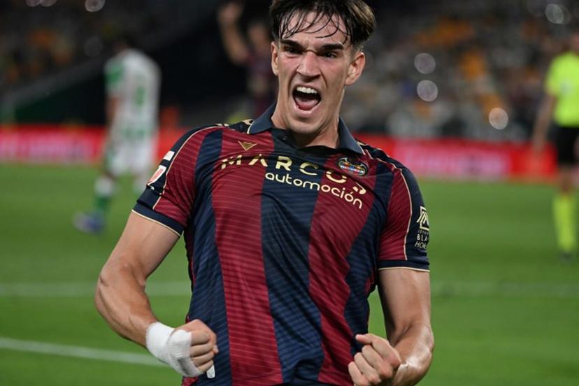 Levante's Spanish forward #19 Carlos Espi Escrihuela celebrates scoring his team's first goal during the Spanish league football match between Real Betis and Levante UD at Benito Villamarin Stadium in Seville on May 23, 2026. CRISTINA QUICLER / AFP