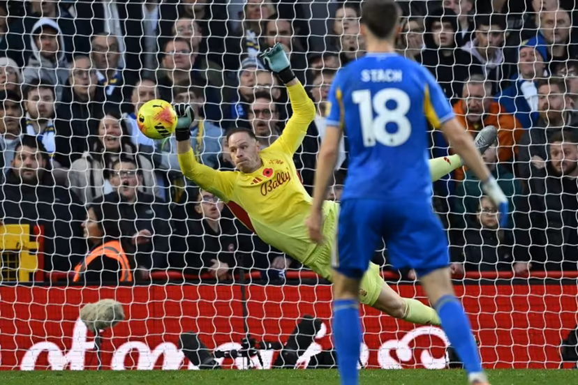 Nottingham Forest's Belgian goalkeeper #26 Matz Sels makes a save during the English Premier League football match between Nottingham Forest and Leeds United at The City Ground in Nottingham, central England, on November 9, 2025. JUSTIN TALLIS / AFP