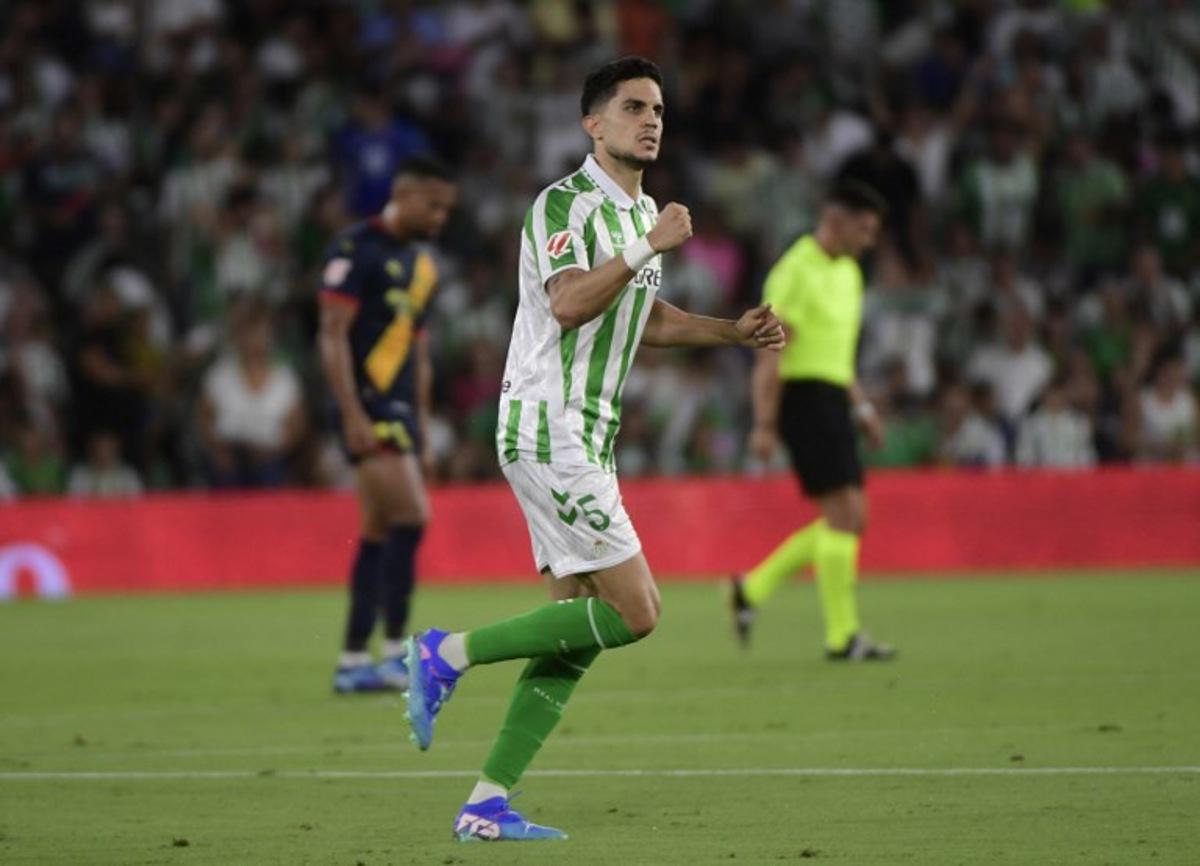 Real Betis' Spanish defender #05 Marc Bartra celebrates scoring his team's first goal during the Spanish league football match between Real Betis and Girona FC at the Benito Villamarin stadium in Seville on August 15, 2024. CRISTINA QUICLER / AFP