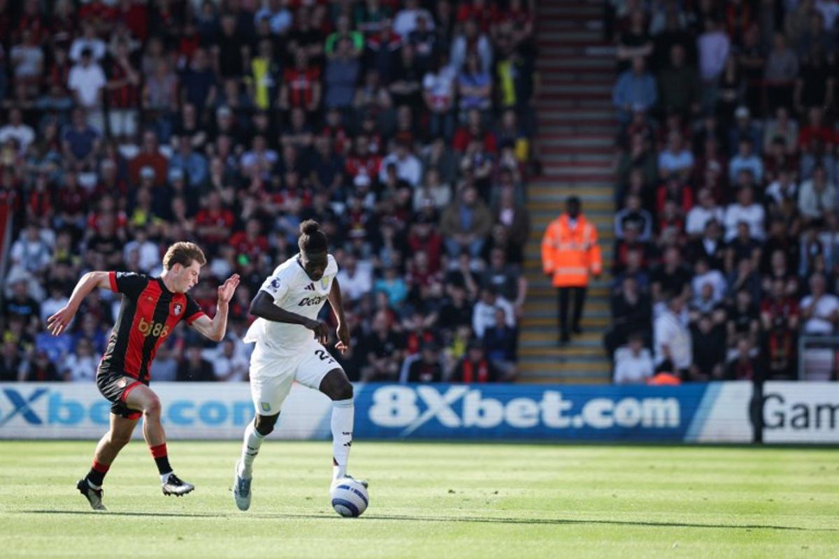 Bournemouth's English midfielder #08 Alex Scott (L) fights for the ball with Aston Villa's Belgian defender #24 Amadou Onana during the English Premier League football match between Bournemouth and Aston Villa at the Vitality Stadium in Bournemouth, southern England on May 10, 2025. Adrian Dennis / AFP