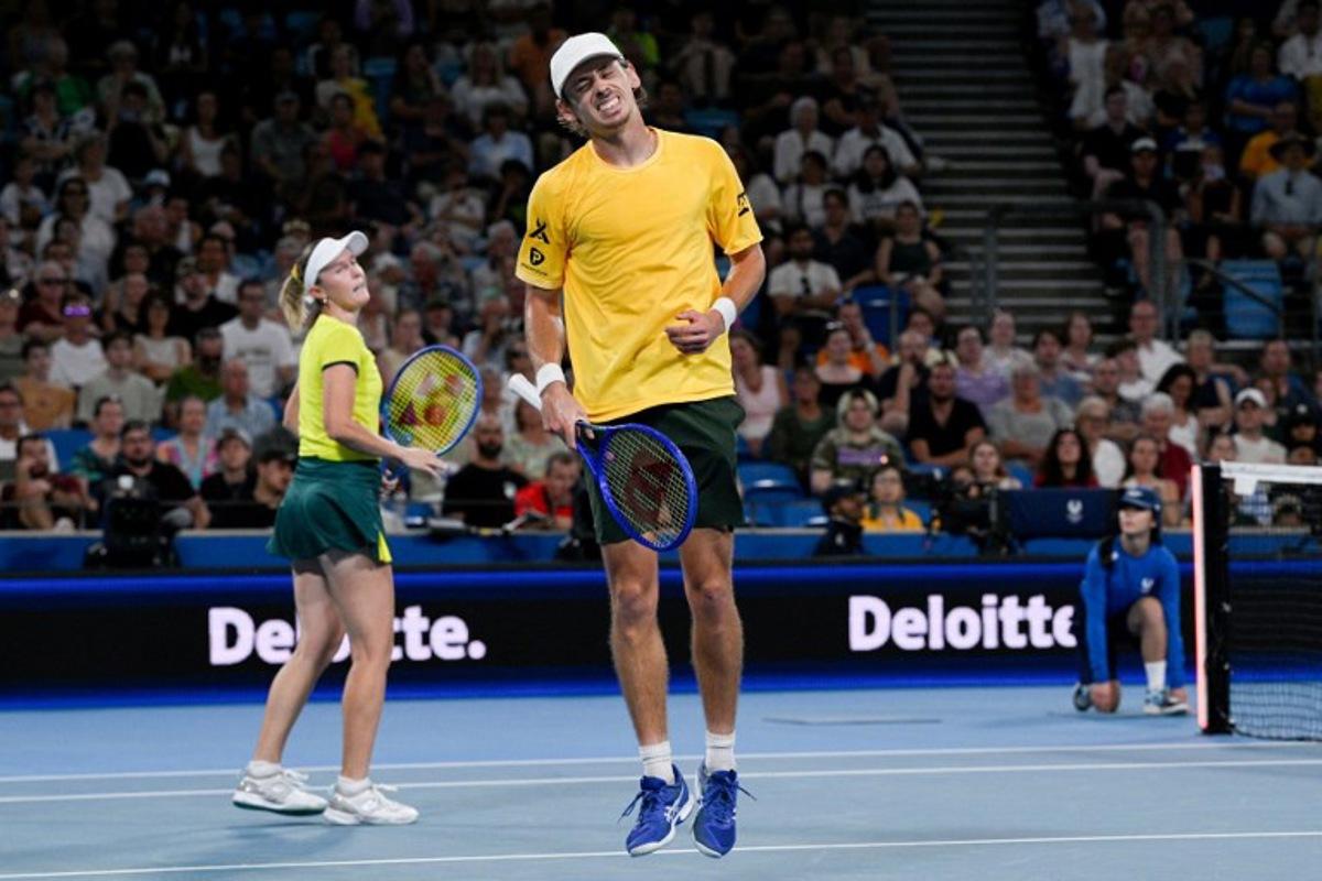 Australia's Alex de Minaur (R) and Storm Hunter react after a point against Czech Republic's Dalibor Svrcina and Miriam Skoch during their mixed doubles match at the United Cup tennis tournament on Ken Rosewall Arena in Sydney on January 6, 2026. Izhar KHAN / AFP