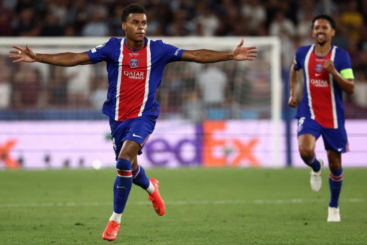 Paris Saint-Germain's French midfielder #14 Desire Doue celebrates scoring the 2-1 goal with his teammates during the UEFA Supercup football match between Champions League winners Paris Saint Germain (PSG) and Europa League winners Aston Villa in Salzburg, Austria on August 12, 2026. FRANCK FIFE / AFP