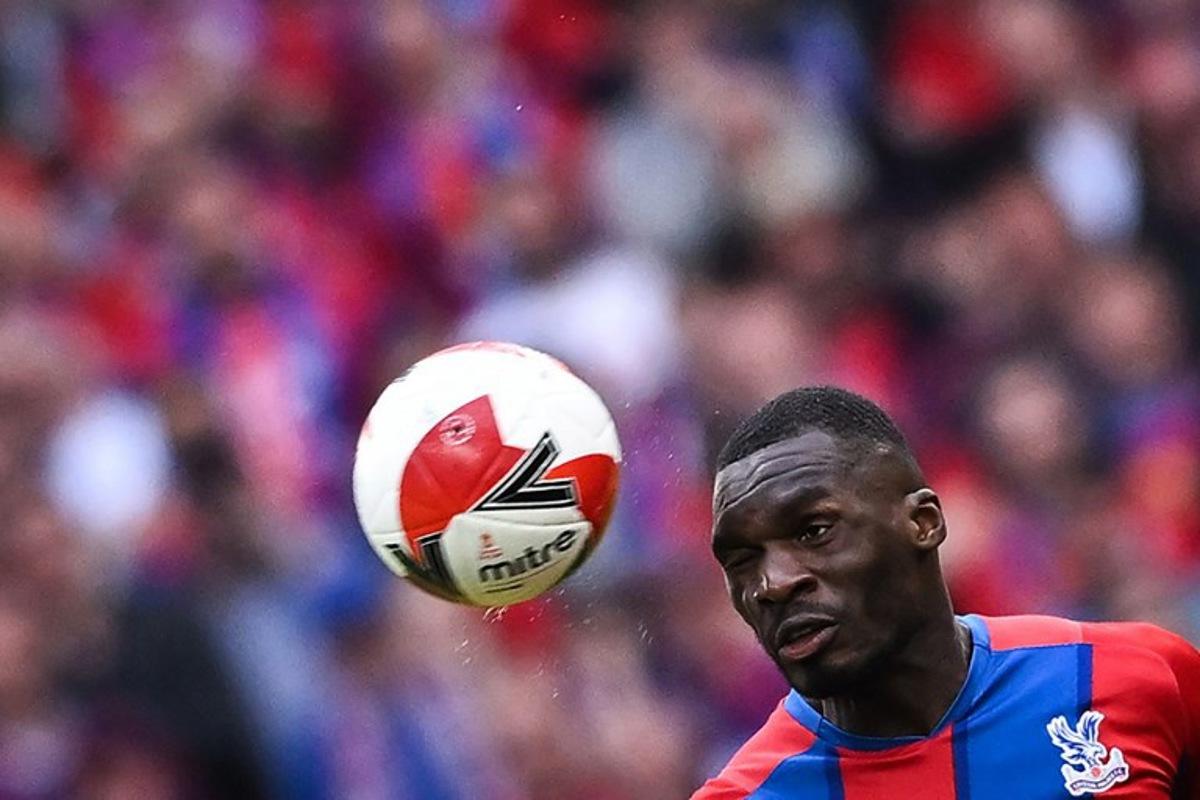 Crystal Palace's Zaire-born Belgian striker Christian Benteke heads the ball during the English FA Cup semi-final football match between Chelsea and Crystal Palace at Wembley Stadium in north west London on April 17, 2022. Ben Stansall / AFP