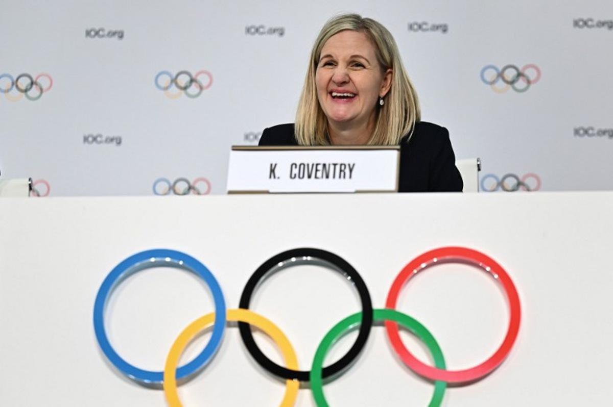 Newly-elected president of the International Olympic Committee (IOC) Zimbabwean Kirsty Coventry reacts during her first press conference during the 144th IOC Session on the day of the election of the President of the International Olympic Committee, in Costa Navarino, Greece on March 20, 2025. Zimbabwe's Kirsty Coventry became the first woman and the first African to be elected president of the International Olympic Committee on March 20, 2025. Fabrice COFFRINI / AFP