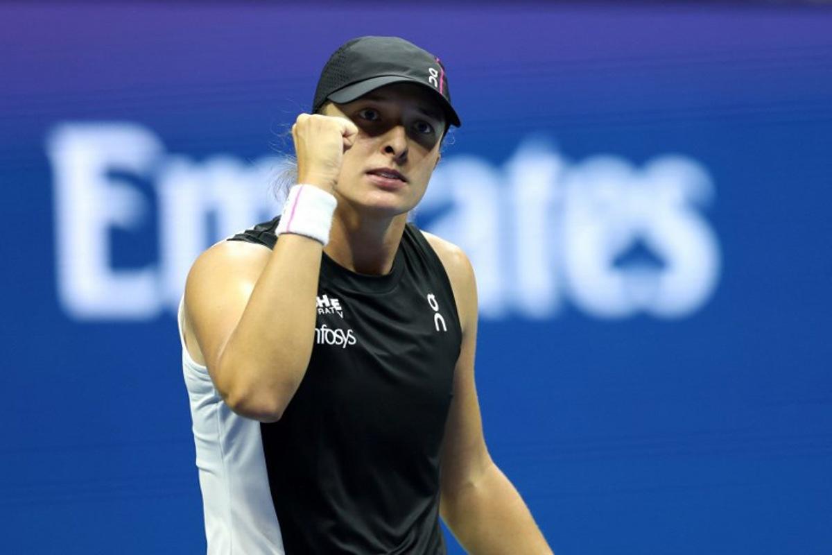 Poland's Iga Swiatek celebrates her victory over Russia's Anna Kalinskaya during their women's singles third round match on day seven of the US Open tennis tournament at the USTA Billie Jean King National Tennis Center in New York City, on August 30, 2025. CHARLY TRIBALLEAU / AFP