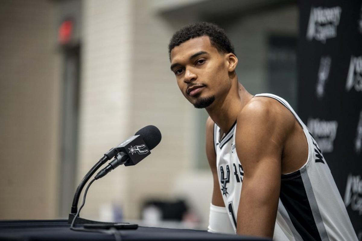 French basketball player Victor Wembanyama speaks to reporters during the San Antonio Spurs media day at the Victory Capital Performance Center in San Antonio, Texas on September 29, 2025. Wembanyama has been cleared by the team's medical staff to play for the upcoming season. SERGIO FLORES / AFP