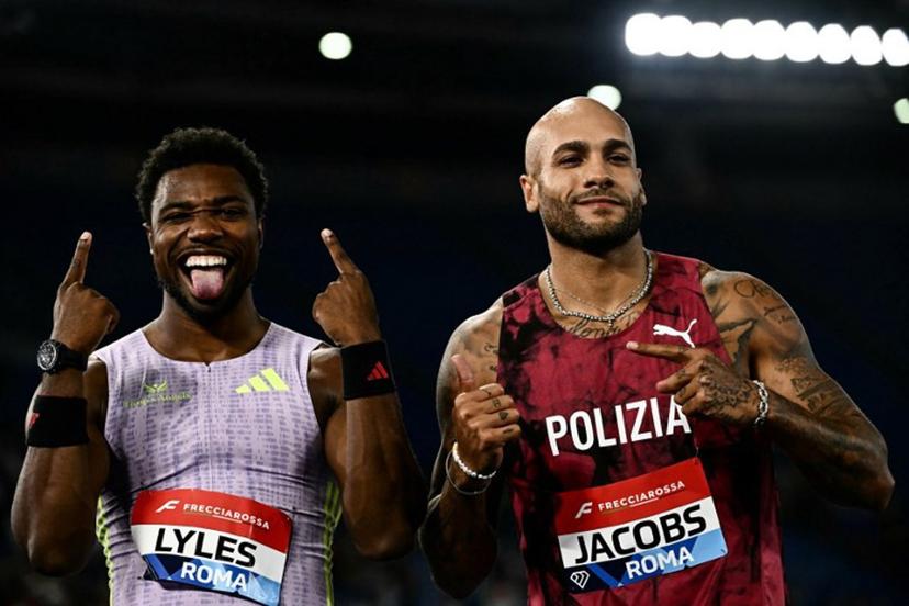 Winner USA's Noah Lyles (L) celebrates next to fifth placed Italy's Marcell Jacobs (R) after competing in the Men's 100m during the IAAF Diamond League athletics meeting, at the Olympic Stadium, in Rome on June 4, 2026. Filippo MONTEFORTE / AFP