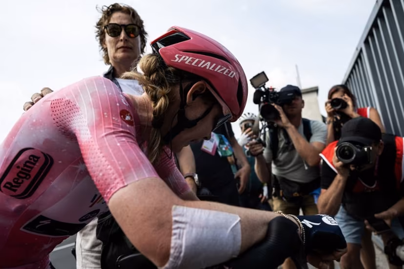 SD Worx Dutch rider Anna Van Der Breggen, wearing the overall leader's pink jersey (Maglia Rosa), reacts after she crossed the finish line after the 9th stage of the Giro Italia Women 2026 - Tour of Italy Women cycling race between Saluzzo and Saluzzo, and place third overall on June 7, 2026. MARCO BERTORELLO / AFP