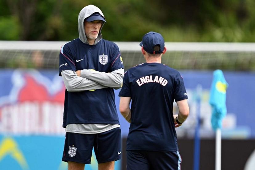 England's German head coach Thomas Tuchel speaks with his assistant during a training session as part of the team's preparation for its FIFA World Cup football tournament opening match against Croatia at the team's training camp in Palm Beach Gardens on June 9, 2026. CHANDAN KHANNA / AFP