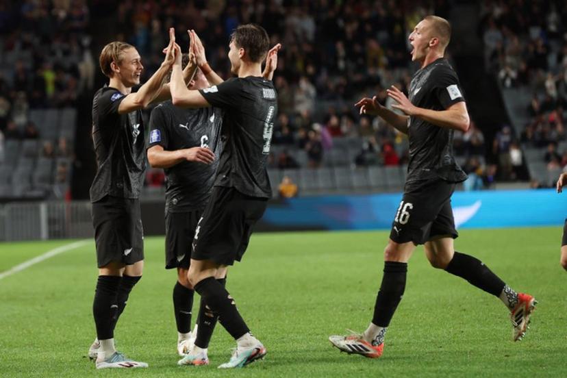 New Zealand's Ben Waine celebrates his goal with teammates during the international friendly football match between New Zealand and Chile at Eden Park in Auckland on March 30, 2026. Michael Bradley / AFP