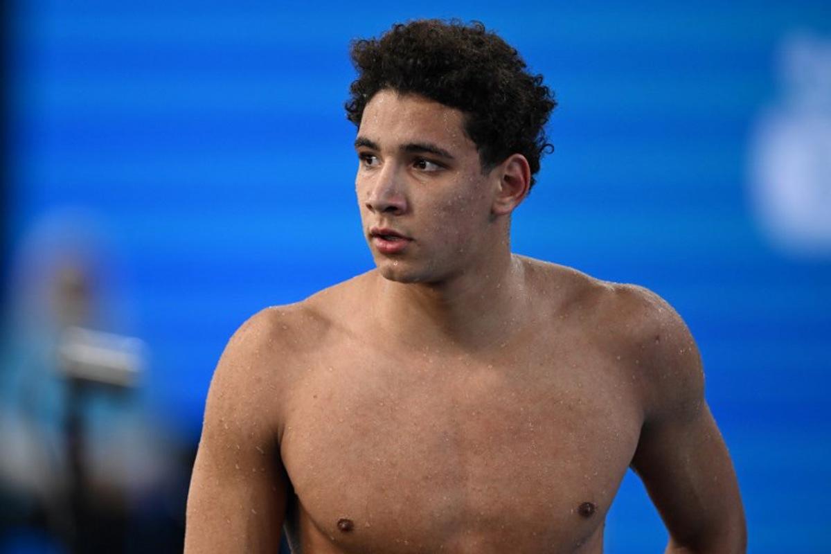 Tunisia's Ahmed Hafnaoui looks on after competing in a heat of the men's 400m freestyle swimming event during the 2024 World Aquatics Championships at Aspire Dome in Doha on February 11, 2024. SEBASTIEN BOZON / AFP