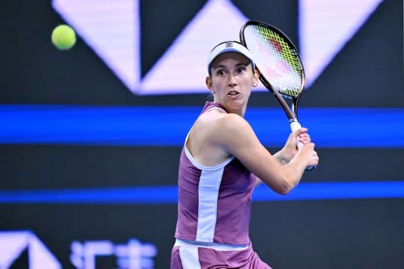 Belgium's Elise Martens hits a return to China's Zheng Qinwen during their women's singles semi-final at the China Open tennis tournament in Beijing on October 10, 2026. Adek BERRY / AFP