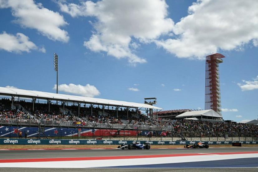 (L/R) Williams' Thai driver Alexander Albon and Red Bull Racing's Japanese driver Yuki Tsunoda race during the United States Formula One Sprint at the Circuit of the Americas in Austin, Texas, on October 18, 2025. RONALDO SCHEMIDT / AFP