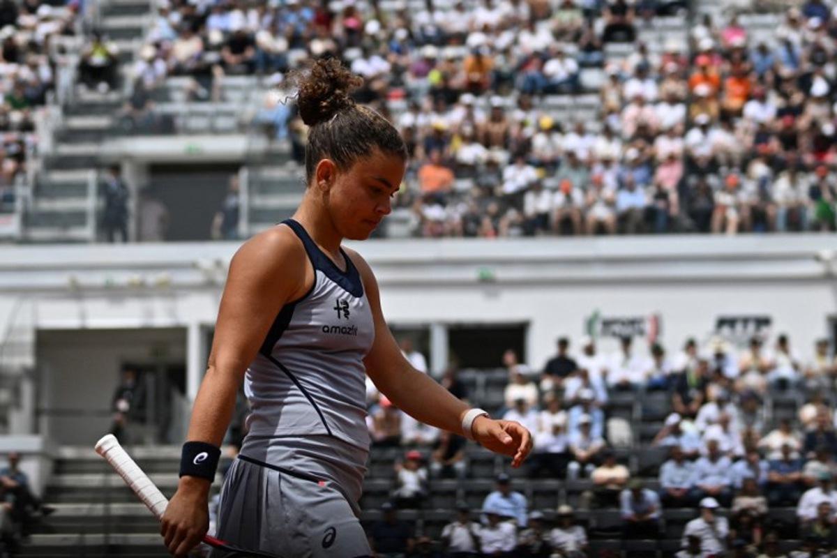 Italy's Jasmine Paolini prepares to serve against Belgium's Elise Mertens during the WTA Rome Open tennis tournament at Foro Italico in Rome on May 9, 2026. Tiziana FABI / AFP
