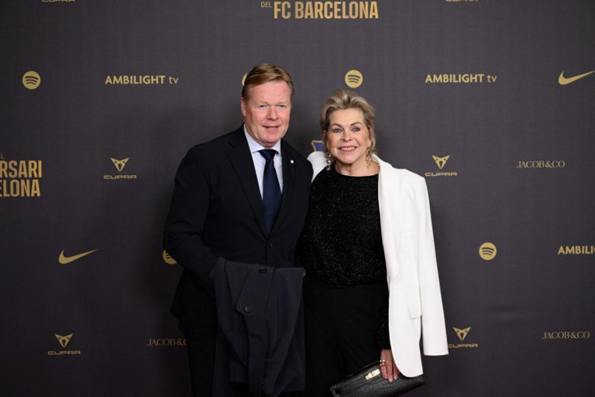 Former Barcelona player and coach Ronald Koeman (L) and his wife Bartina arrive to attend a gala in celebration of the 125th anniversary of the founding of FC Barcelona, in the Gran Teatre del Liceu theatre in Barcelona on November 29, 2024. Josep LAGO / AFP