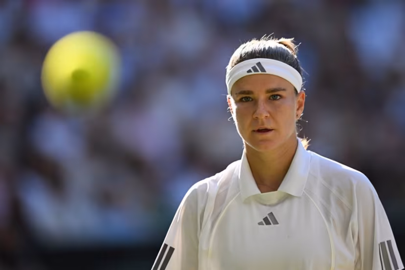 Czech Republic's Karolina Muchova focuses on the ball whilst playing against Czech Republic's Linda Noskova during their women's singles final tennis match on the thirteenth day of the 2026 Wimbledon Championships at The All England Lawn Tennis and Croquet Club in Wimbledon, southwest London, on July 11, 2026. Kirill KUDRYAVTSEV / AFP