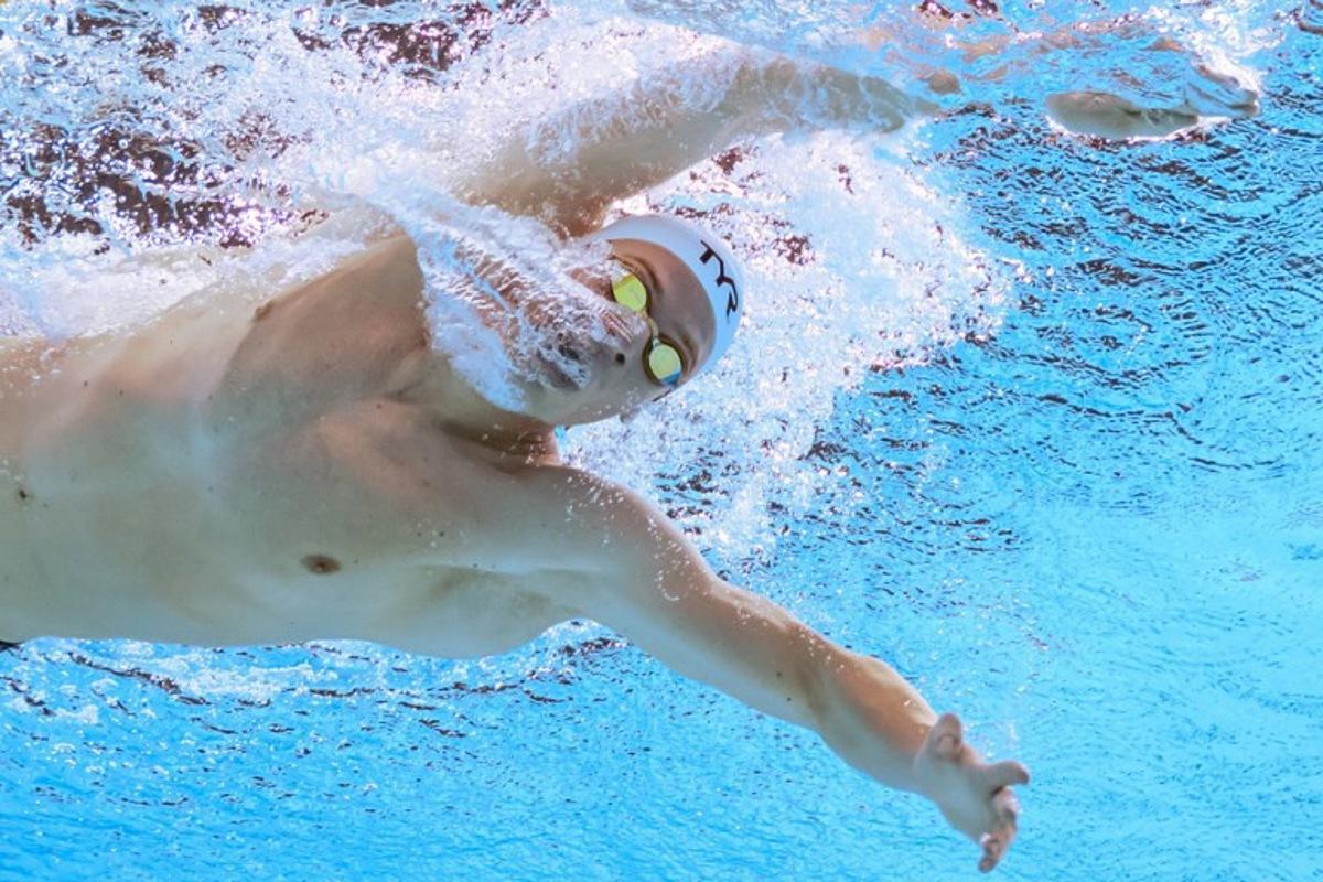 France's swimmer Leon Marchand competes in a heat of the men's 400m individual medley swimming event during the 2025 World Aquatics Championships in Singapore on August 3, 2025. François-Xavier MARIT / AFP