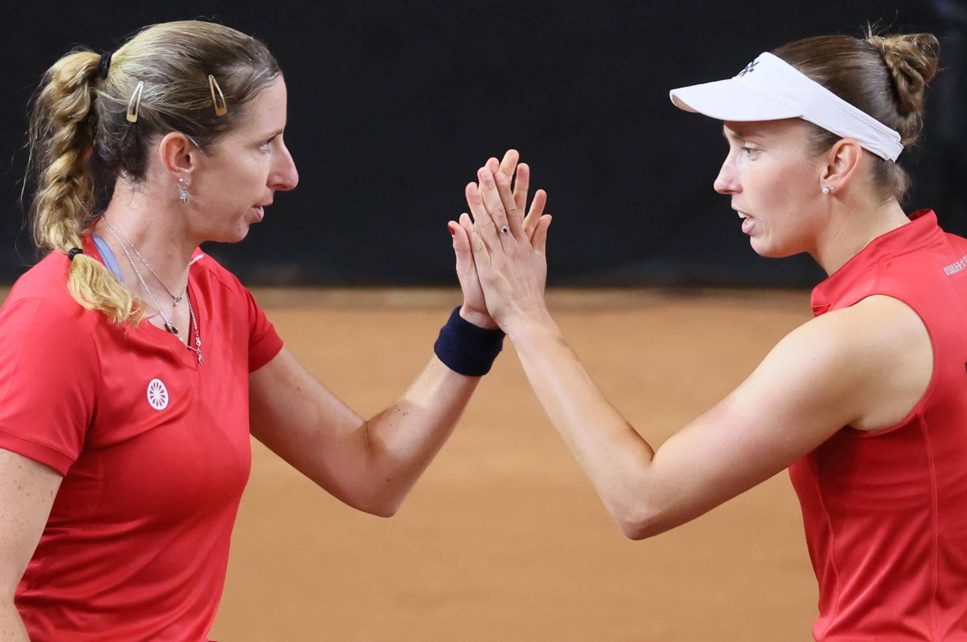 Belgian Magali Kempen and Belgian Elise Mertens pictured during the third game, a double game between Belgian pair Kempen/ Mertens and US pair McNally/ Melichar on the second day of the qualifiers of the Billie Jean King Cup tennis between Belgium and the USA, in Oostende, Belgium, on . The meeting takes place on 10 and 11th April. PHOTO BENOIT DOPPAGNE