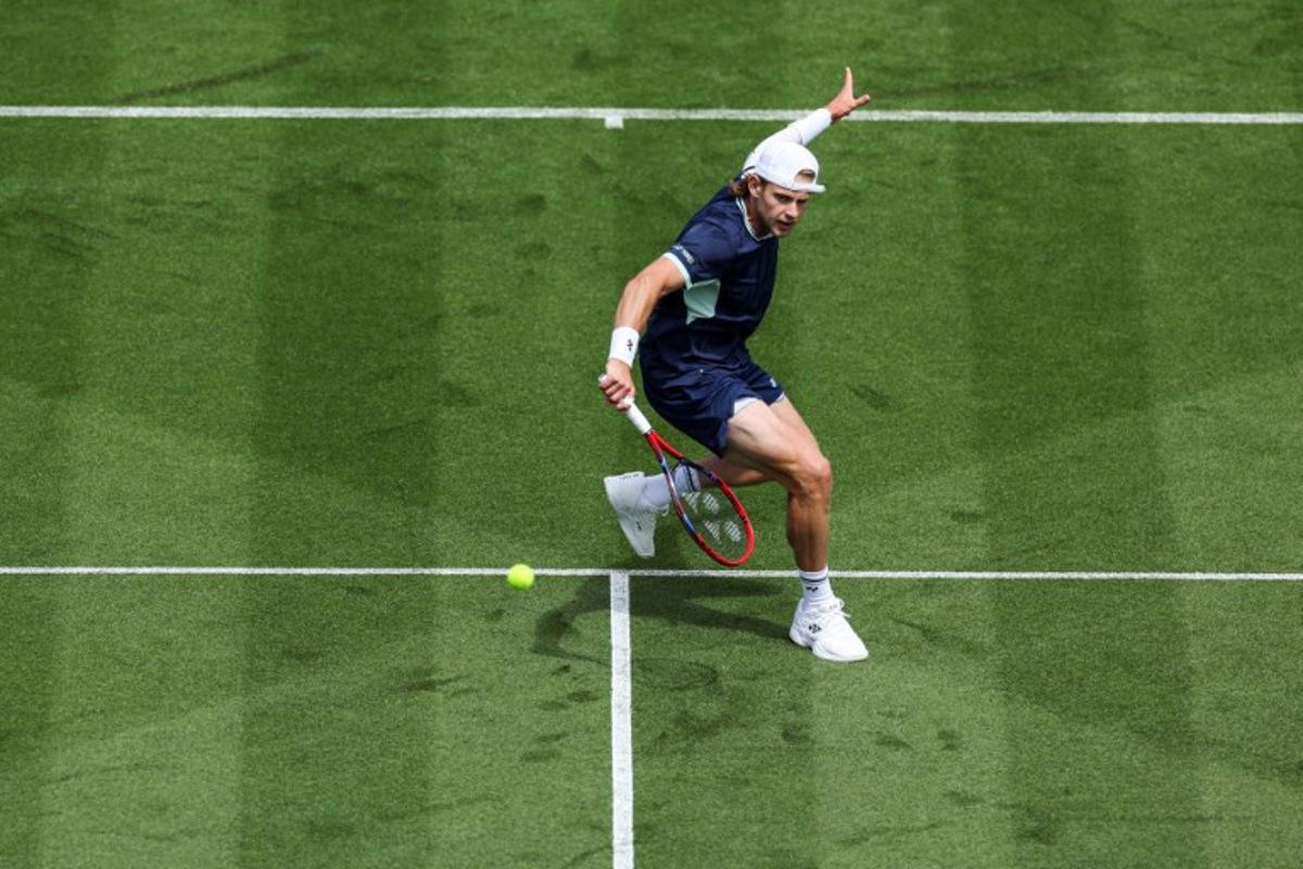 Belgium's Zizou Bergs plays a forehand return to Brazil's Joao Fonseca during their men's singles tennis match on day one at the Lexus Eastbourne International tennis tournament in Eastbourne, southern England, on June 23, 2025. Adrian Dennis / AFP