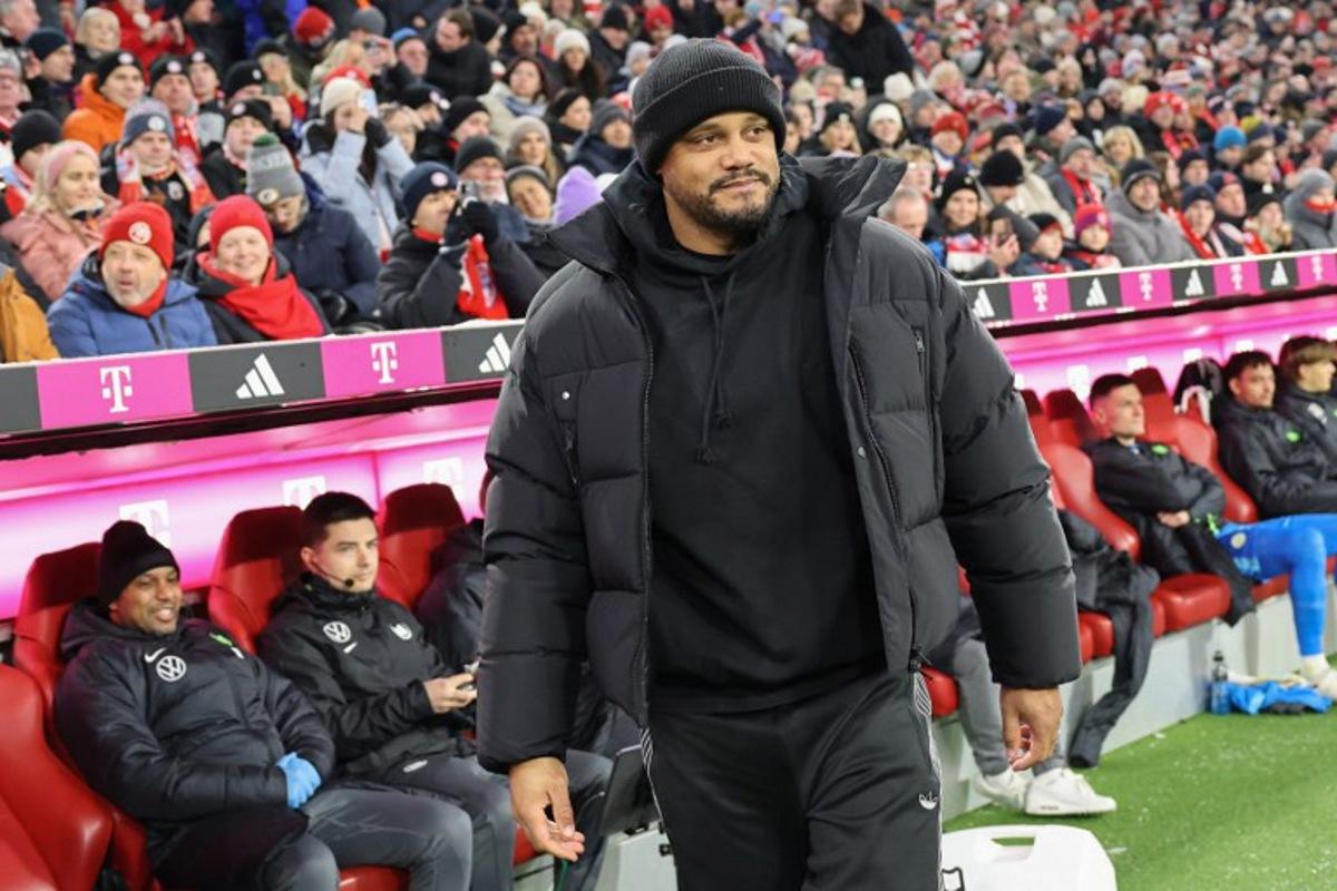 Bayern Munich's Belgian head coach Vincent Kompany reacts from the sidelines during the German first division Bundesliga football match between FC Bayern Munich and VfL Wolfsburg in Munich, southern Germany, on January 11, 2026. Alexandra BEIER / AFP