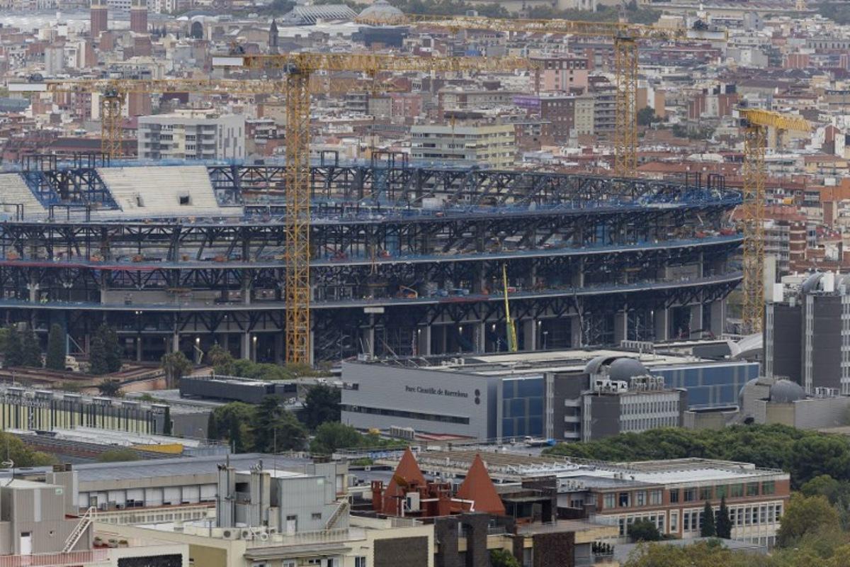 Cranes are pictured as construction continues on the FC Barcelona's Camp Nou Stadium in Barcelona on October 29, 2025. Josep LAGO / AFP