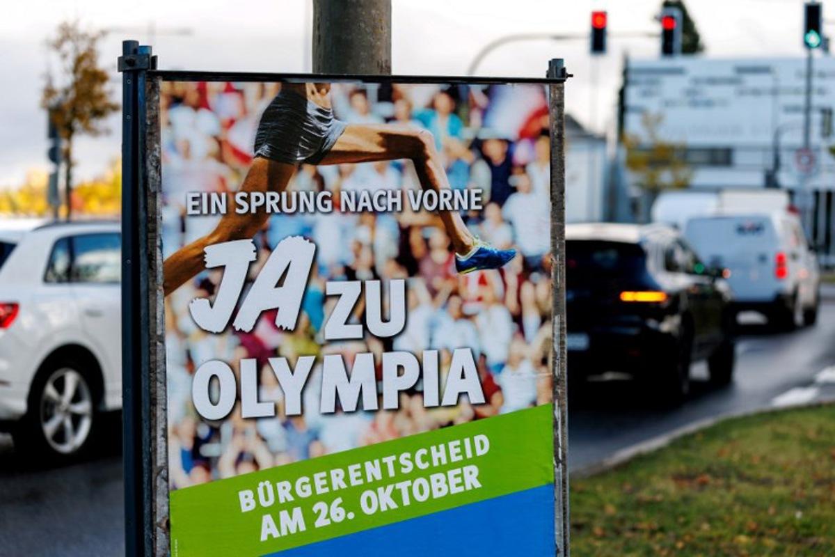 A photo taken on October 24, 2025 shows a placard with the lettering 'A jump ahead - Yes to the Olympics' in Munich, southern Germany, ahead of a citizens' decision on the bid of the city of Munich to organize the Olympic Summer Games from 2036. On October 26, 2025, citizens of Munich will decide on the city's bid to organize the Olympic and Paralympic Summer Games in 2036, 2040 or 2044. Matthias BALK / AFP