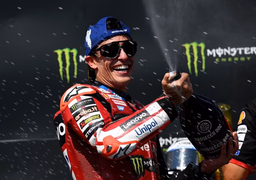 Team Ducati Lenovo Team's Marc Marquez celebrates on the podium with sparkling wine after winning the MotoGP Grand Prix of Czechia in Brno, Czech Republic, on June 21, 2026. Michal Cizek / AFP