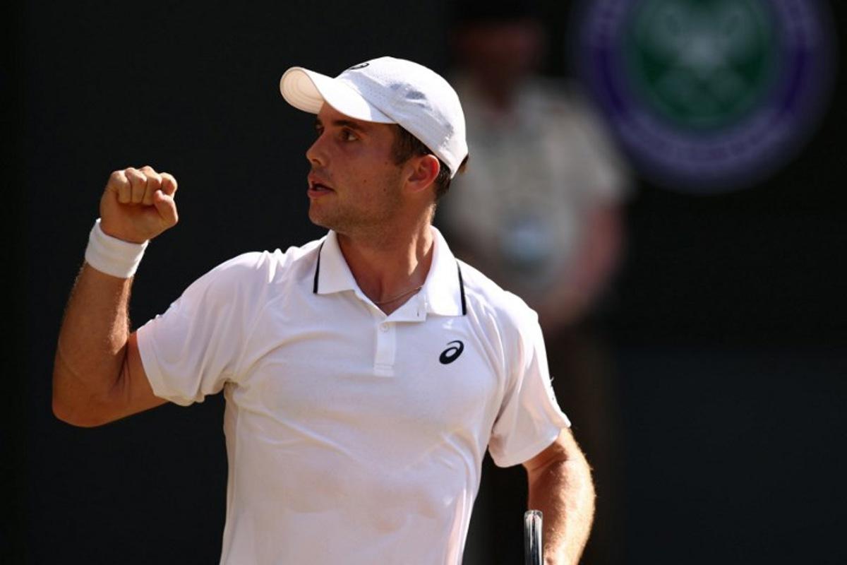 Britain's Arthur Fery celebrates winning the second set against Italy's Flavio Cobolli during their men's singles quarter-final tennis match on the tenth day of the 2026 Wimbledon Championships at The All England Lawn Tennis and Croquet Club in Wimbledon, southwest London, on July 8, 2026. Henry Nicholls / AFP