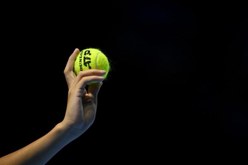 A ballboy hold up a tennis ball during a men's quarter final match at the Swiss Indoors ATP 500 tennis tournament in Basel on October 25, 2024. Fabrice COFFRINI / AFP