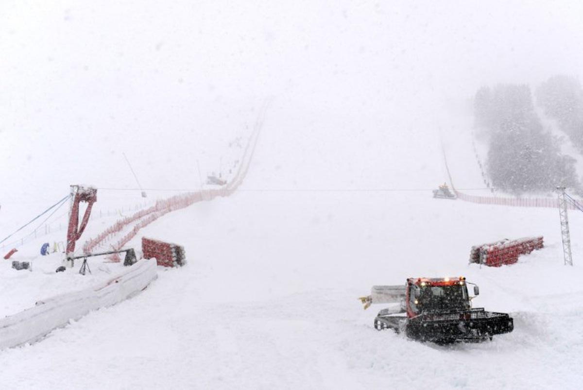 A snowplow tries to prepare the finish area under heavy snowfall on December 16, 2011, on the eve of the FIS Women's World Cup Alpine skiing in Courchevel, French Alps. This weather around Courchevel has forced organisers of this weekend's World Cup to switch two women's slalom races. AFP PHOTO/PHILIPPE DESMAZES PHILIPPE DESMAZES / AFP