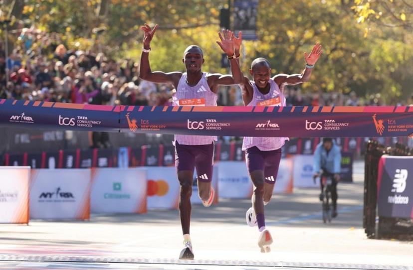 Kenyans Benson Kipruto (L) and Alexander Mutiso celebrate taking first and second place respectively in the New York Marathon in New York on November 2, 2025. CHARLY TRIBALLEAU / AFP