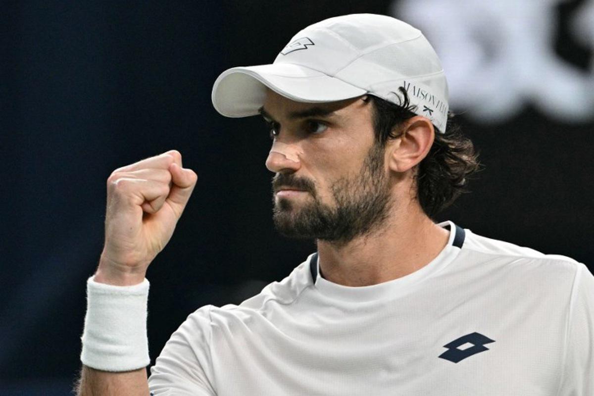 Monaco's Valentin Vacherot reacts after a point against France's Arthur Rinderknech during the men's singles final at the Shanghai Masters tennis tournament in Shanghai on October 12, 2025. HECTOR RETAMAL / AFP