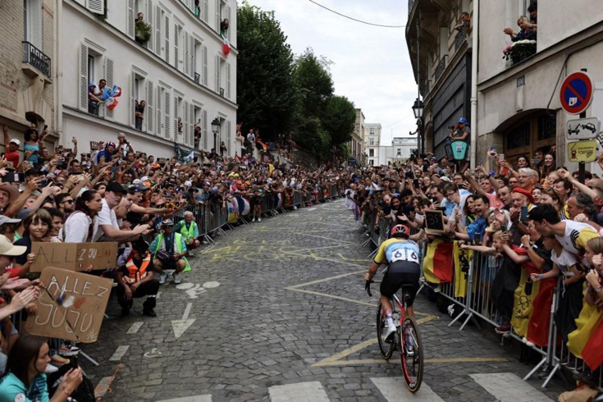 Belgium's Remco Evenepoel cycles in a lone breakaway in Montmartre during the men's cycling road race during the Paris 2024 Olympic Games in Paris, on August 3, 2024. Tim De Waele / POOL / AFP