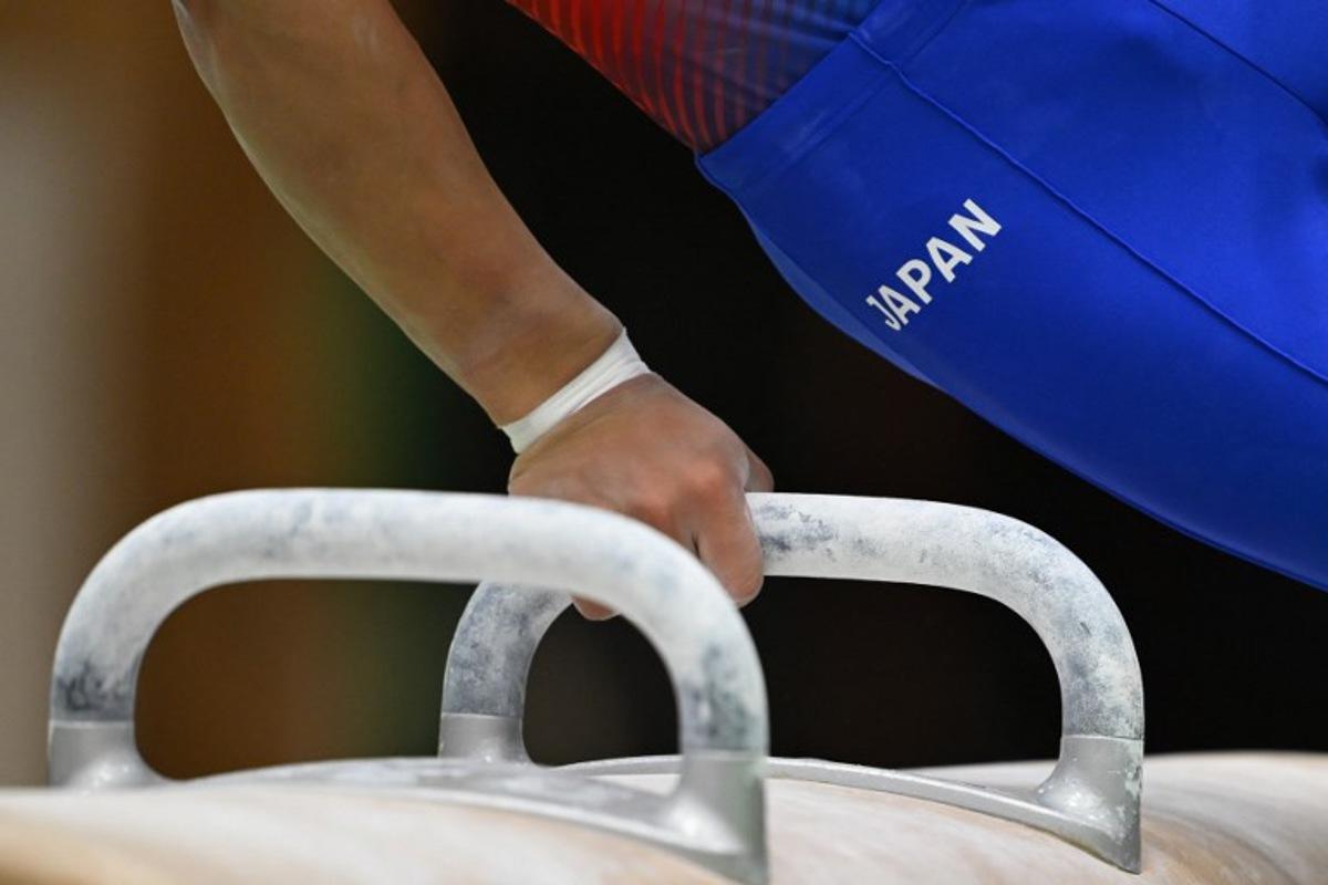 A gymnast practices the pommel horse during a Japan team training exhibition for the media ahead of the Aichi-Nagoya Asian Games in Tokyo on September 9, 2026. ANDREW CABALLERO-REYNOLDS / AFP